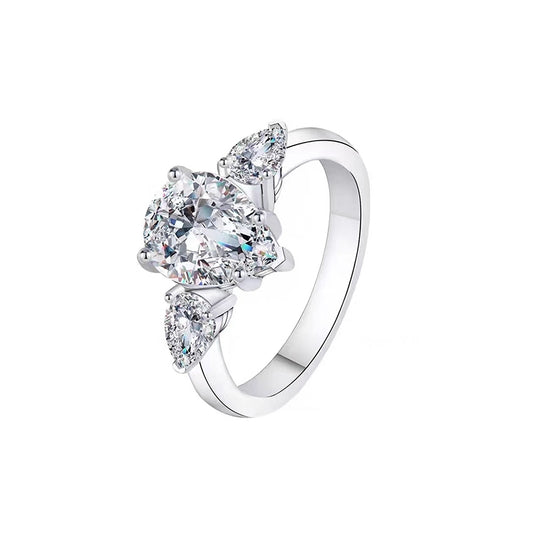 Drop - shaped three - stone diamond ring.