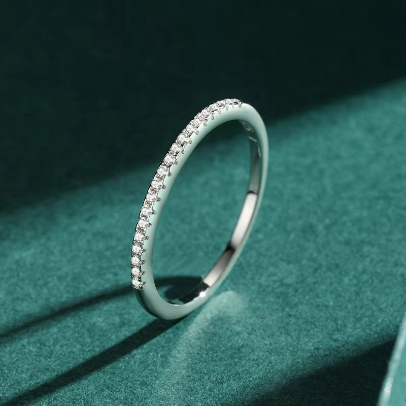 Half - circle pavé ring.